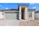 Inviting single-story home featuring stone accents, low-maintenance landscaping, and a spacious two-car garage at 20316 W Turney Ave, Buckeye, AZ 85396