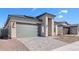 Charming single-story home with a two car garage, stone accents, paver driveway and low maintenance landscaping at 20316 W Turney Ave, Buckeye, AZ 85396