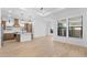 Open concept living room with access to kitchen, stylish fixtures, tile floors, and ample natural light at 20316 W Turney Ave, Buckeye, AZ 85396