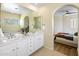 Bathroom features a double vanity and an arched entryway at 20802 N Grayhawk Dr # 1142, Scottsdale, AZ 85255