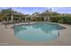 Inviting community pool with lounge chairs and covered seating area at 20802 N Grayhawk Dr # 1142, Scottsdale, AZ 85255