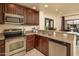 Kitchen with stainless steel appliances and granite countertops at 21320 N 56Th St # 2066, Phoenix, AZ 85054