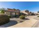 Two-story house with brown garage doors and landscaping at 21391 E Camina Plata --, Queen Creek, AZ 85142