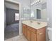 Double sink bathroom with access to bedroom at 2201 N 91St Gln, Phoenix, AZ 85037