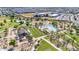 Aerial view of community amenities, including pool, park, and school at 22910 E Sonoqui Blvd, Queen Creek, AZ 85142