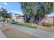 House exterior with a two-car garage and landscaped yard at 22910 E Sonoqui Blvd, Queen Creek, AZ 85142