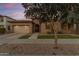 House exterior showcasing a front porch and mature tree at 22910 E Sonoqui Blvd, Queen Creek, AZ 85142