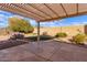 Landscaped backyard with pergola, putting green, and plants at 2505 S Copperwood Ave, Mesa, AZ 85209