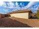 House exterior view showcasing backyard and gravel at 2505 S Copperwood Ave, Mesa, AZ 85209