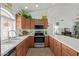 Galley kitchen with stainless steel appliances and ample counter space at 2505 S Copperwood Ave, Mesa, AZ 85209