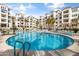 Resort-style pool with multiple lounge chairs and surrounding buildings at 2511 W Queen Creek Rd # 124, Chandler, AZ 85248