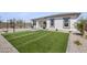 Artificial turf backyard with pergola and string lights at 25224 N 159Th Dr, Surprise, AZ 85387