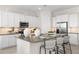 Modern kitchen with white cabinets, large island, and stainless steel appliances at 25224 N 159Th Dr, Surprise, AZ 85387