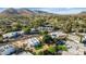 Aerial view of a luxury home community with mountain views and a pool at 26 E Boca Raton Rd, Phoenix, AZ 85022