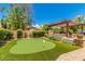 Putting green and pergola in backyard at 2976 E Cullumber St, Gilbert, AZ 85234