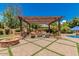 Outdoor oasis with pergola, fireplace, and built-in grill at 2976 E Cullumber St, Gilbert, AZ 85234