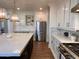 Modern kitchen with large island and white cabinets at 2976 E Cullumber St, Gilbert, AZ 85234