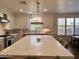 Modern kitchen with white cabinets and large island at 2976 E Cullumber St, Gilbert, AZ 85234