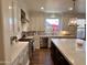 Modern kitchen with white cabinets and large island at 2976 E Cullumber St, Gilbert, AZ 85234
