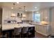 Bright kitchen, white cabinets, large island, hardwood floors at 2976 E Cullumber St, Gilbert, AZ 85234