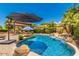 Relaxing pool area with large umbrella at 2976 E Cullumber St, Gilbert, AZ 85234