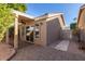 Covered patio with pavers, ceiling fan and access to the backyard at 3336 N Saffron St, Mesa, AZ 85215