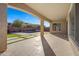 Covered patio overlooks a refreshing pool and grassy backyard at 34801 N 53Rd St # 10, Cave Creek, AZ 85331