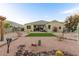 Landscaped backyard with artificial turf and pergola at 3583 N Brooklyn Dr, Buckeye, AZ 85396