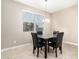 Dining area with a granite-topped table and four chairs at 3583 N Brooklyn Dr, Buckeye, AZ 85396