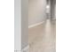 Clean hallway with neutral-toned tile flooring at 3583 N Brooklyn Dr, Buckeye, AZ 85396
