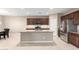 Kitchen with an island, stainless steel appliances, and granite countertops at 3583 N Brooklyn Dr, Buckeye, AZ 85396