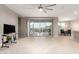 Bright living area with sliding glass doors opening to a patio at 3583 N Brooklyn Dr, Buckeye, AZ 85396
