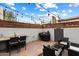 Outdoor patio with seating area, string lights and grill at 3606 E Osborn Rd, Phoenix, AZ 85018