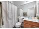 Clean bathroom with shower/tub combo and wood vanity at 44192 W Canyon Creek Dr, Maricopa, AZ 85139