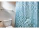 Bathroom with toilet and teal shower curtain at 44192 W Canyon Creek Dr, Maricopa, AZ 85139