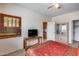 Bedroom with a TV, wooden furniture, and closet at 44192 W Canyon Creek Dr, Maricopa, AZ 85139