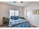 Cozy bedroom with a queen-size bed and nightstands at 44192 W Canyon Creek Dr, Maricopa, AZ 85139