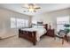 Main bedroom with a king-size bed and walk-in closet at 44192 W Canyon Creek Dr, Maricopa, AZ 85139