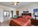 Bedroom with a queen-size bed, wooden furniture, and closet at 44192 W Canyon Creek Dr, Maricopa, AZ 85139