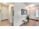 Light and airy entryway with tile floors and storage bench at 44192 W Canyon Creek Dr, Maricopa, AZ 85139