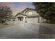 Two-story home with a large driveway and landscaped yard at 44192 W Canyon Creek Dr, Maricopa, AZ 85139