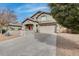 Two-story house with a large driveway and desert landscaping at 44192 W Canyon Creek Dr, Maricopa, AZ 85139
