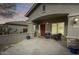 Charming front porch with seating and stone accents at 44192 W Canyon Creek Dr, Maricopa, AZ 85139