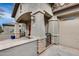 Covered patio with stone columns and wrought-iron gate at 44192 W Canyon Creek Dr, Maricopa, AZ 85139