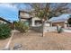 Landscaped front yard with drought-tolerant plants at 44192 W Canyon Creek Dr, Maricopa, AZ 85139