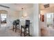 Upstairs hallway with two barstools and views into other rooms at 44192 W Canyon Creek Dr, Maricopa, AZ 85139