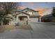 Two-story house with desert landscaping and driveway at 44192 W Canyon Creek Dr, Maricopa, AZ 85139