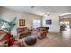 Spacious living room featuring comfortable seating and a grand piano at 44192 W Canyon Creek Dr, Maricopa, AZ 85139