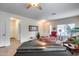 Open living room with piano, seating area, and entryway view at 44192 W Canyon Creek Dr, Maricopa, AZ 85139