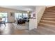 Open living room with tiled floors and access to backyard at 44192 W Canyon Creek Dr, Maricopa, AZ 85139